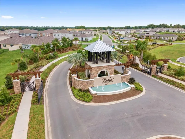an aerial view of a house with outdoor space lake view