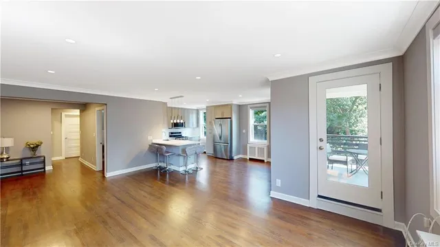 a view of a livingroom with furniture hardwood floor and a living room