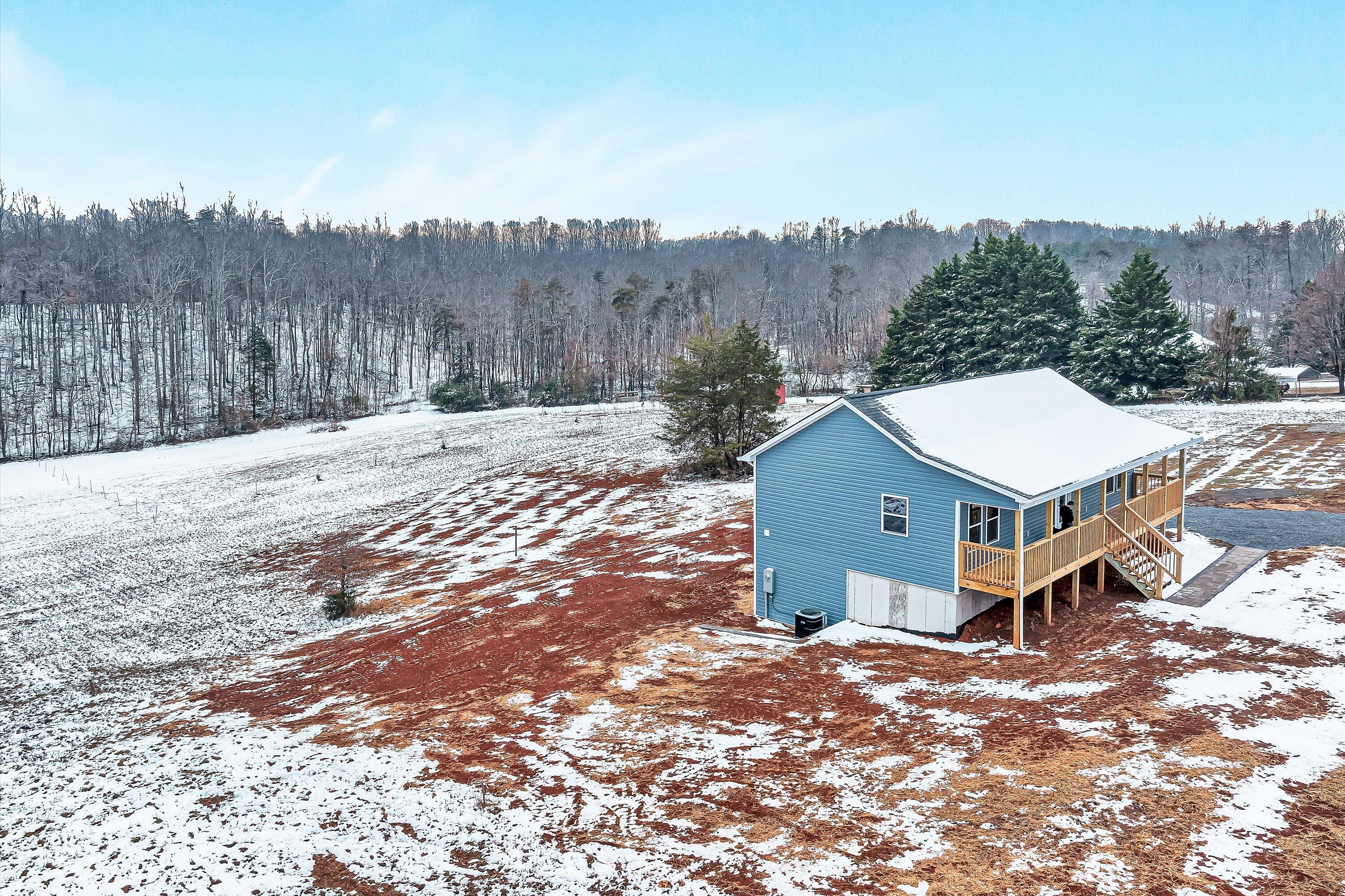688 Wysong Ml Road Hardy, VA 24101 - Photo 34 of 42 an aerial view of a house with a yard and trees all around