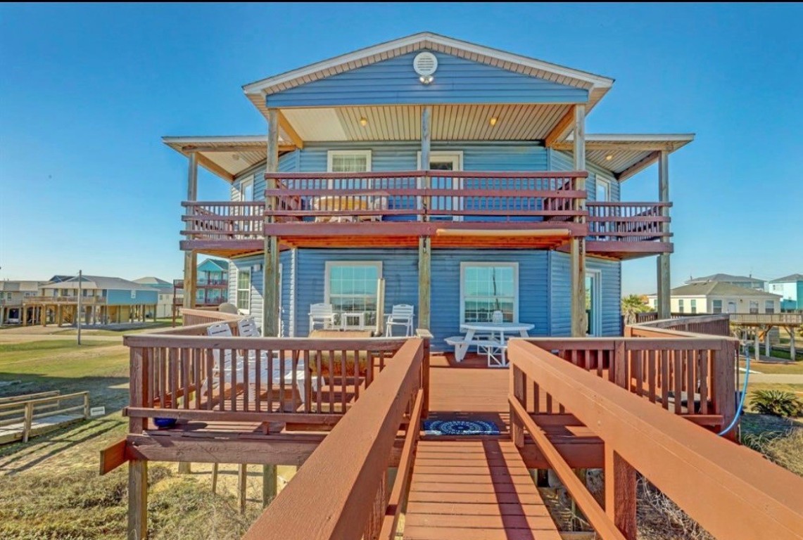 601 Wave Court Surfside Beach, TX 77541 - Photo 1 of 47 Beach side of home showing large decks and dune walkover