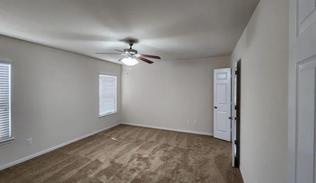 a spacious bathroom with a bathtub and a double vanity sink