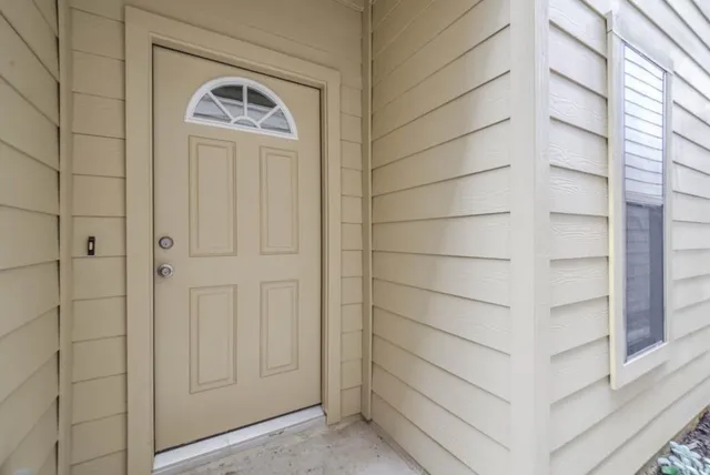 a view of a livingroom with a ceiling fan and window