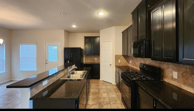 a kitchen with a sink and a window
