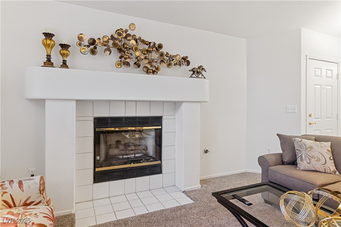2297 Camel Mesa Drive Laughlin, NV 89029 - Photo 12 of 98 Living area featuring a tile fireplace and light carpet