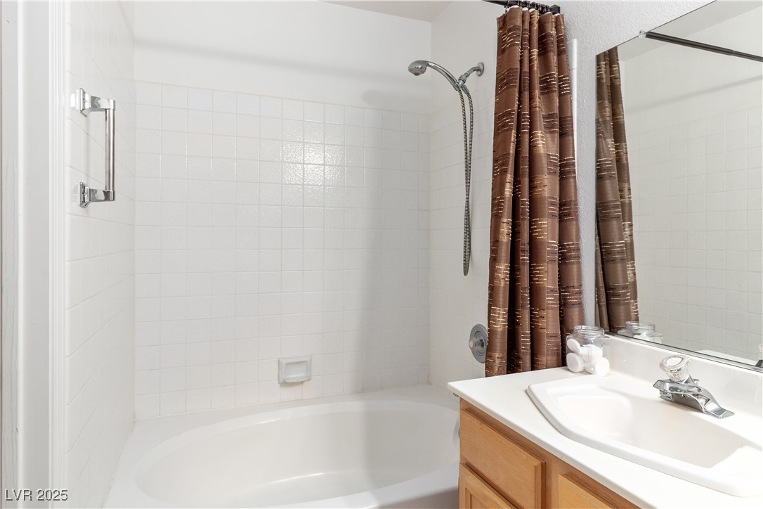 2297 Camel Mesa Drive Laughlin, NV 89029 - Photo 25 of 98 Primary Bathroom featuring shower / tub combo with curtain and vanity