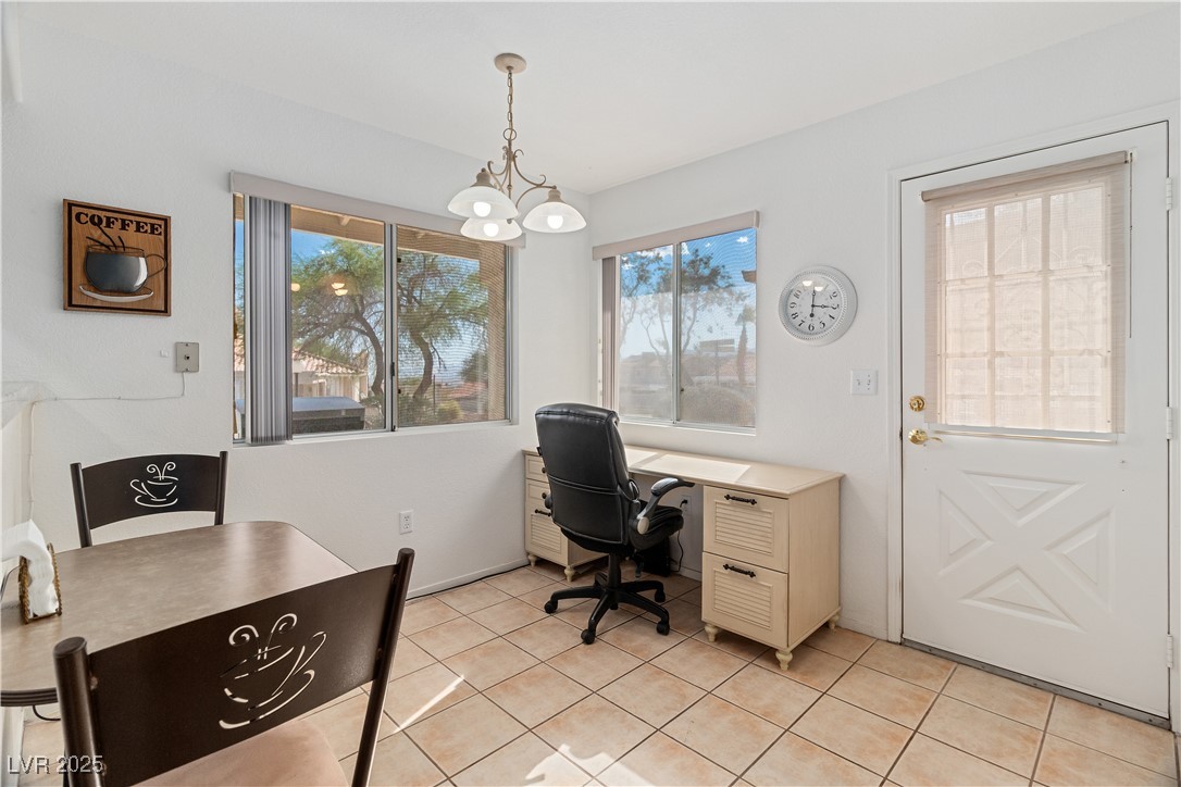 2297 Camel Mesa Drive Laughlin, NV 89029 - Photo 30 of 98 Breakfast area with light tile patterned floors and a chandelier