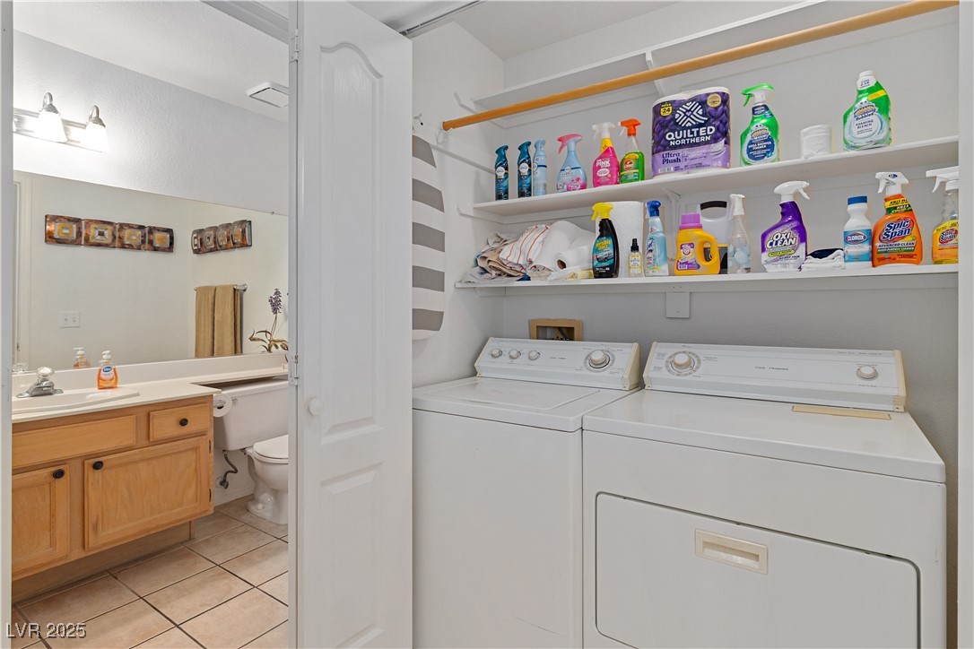 2297 Camel Mesa Drive Laughlin, NV 89029 - Photo 46 of 98 Laundry area / closet featuring light tile patterned floors and washer and clothes dryer