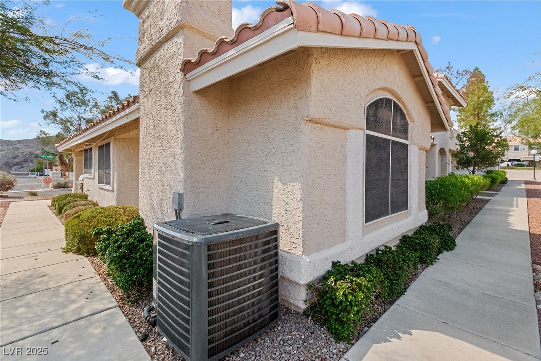 2297 Camel Mesa Drive Laughlin, NV 89029 - Photo 59 of 98 View of back of home with a tile roof, stucco siding, and a mountain view