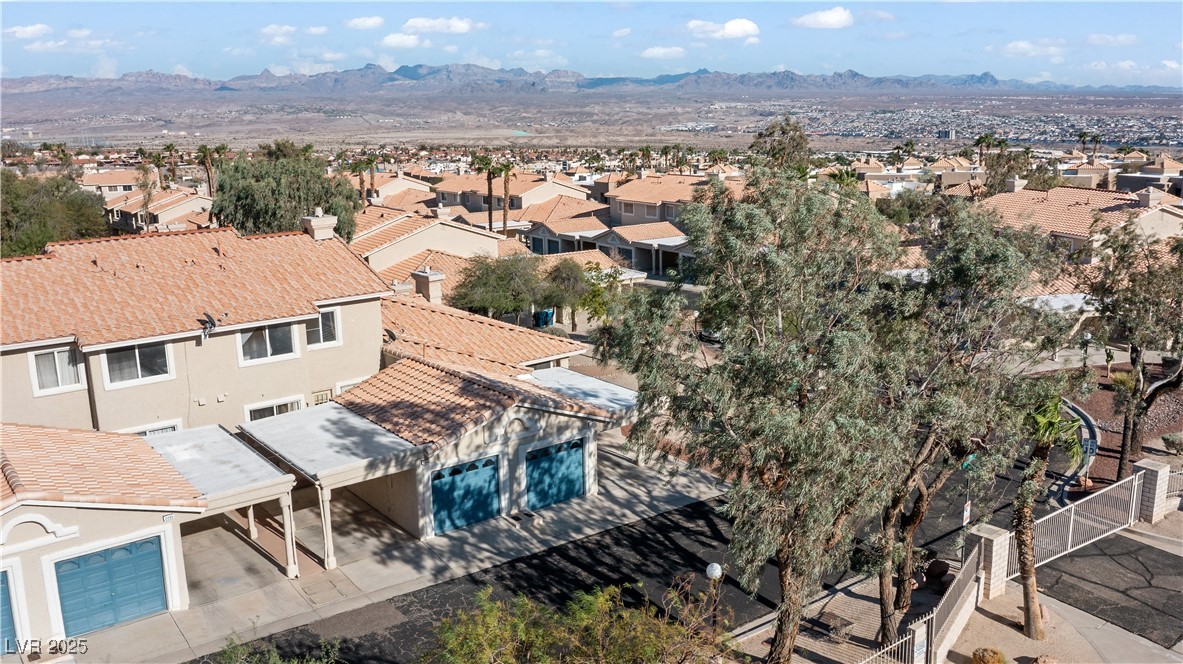 2297 Camel Mesa Drive Laughlin, NV 89029 - Photo 74 of 98 Aerial perspective of suburban area with a mountain backdrop and a pool