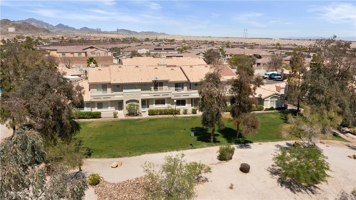 2297 Camel Mesa Drive Laughlin, NV 89029 - Photo 80 of 98 Aerial view of grassy community area with a mountain backdrop