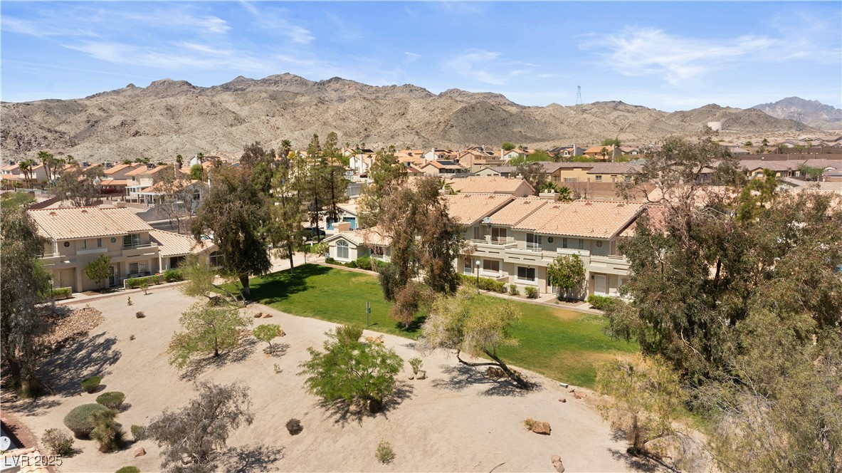 2297 Camel Mesa Drive Laughlin, NV 89029 - Photo 81 of 98 Aerial view of grassy community area with a mountain backdrop