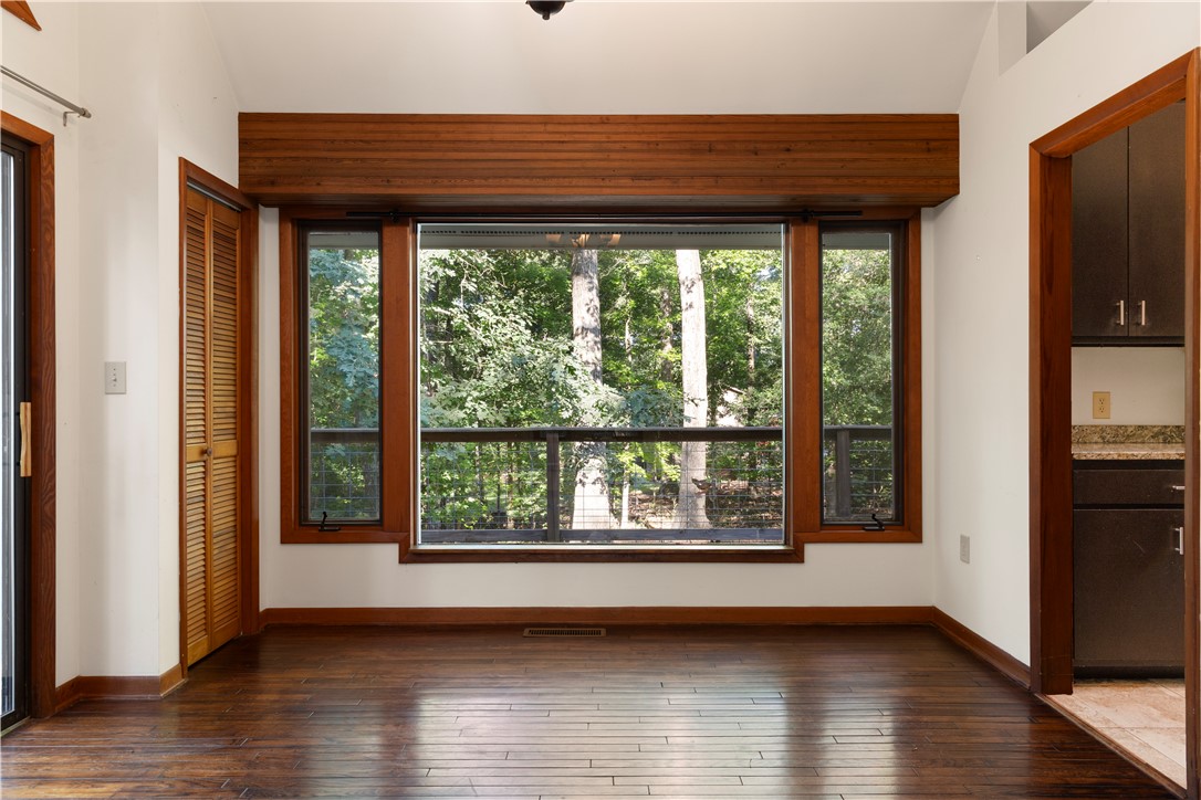 1298 Carradine Road Seneca, SC 29678 - Photo 18 of 43 Hardwood floors and generous windows frame stunning outdoor views.