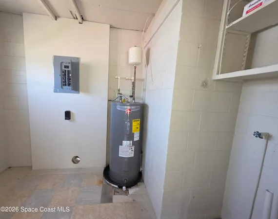 a view of storage and utility room with wooden floor