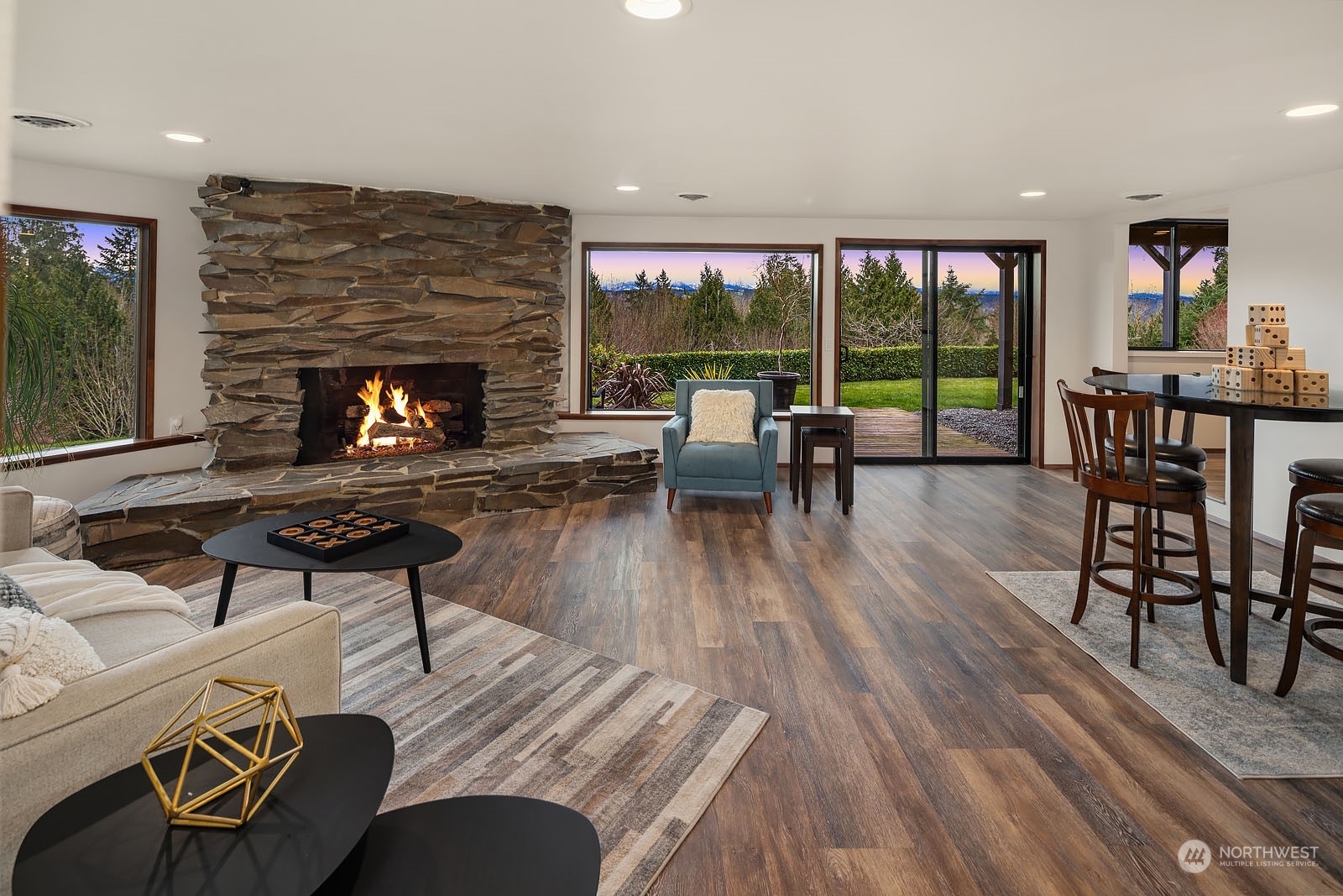14050 184th Avenue Northeast Woodinville, WA 98072 - Photo 16 of 38 a living room with furniture and a fireplace