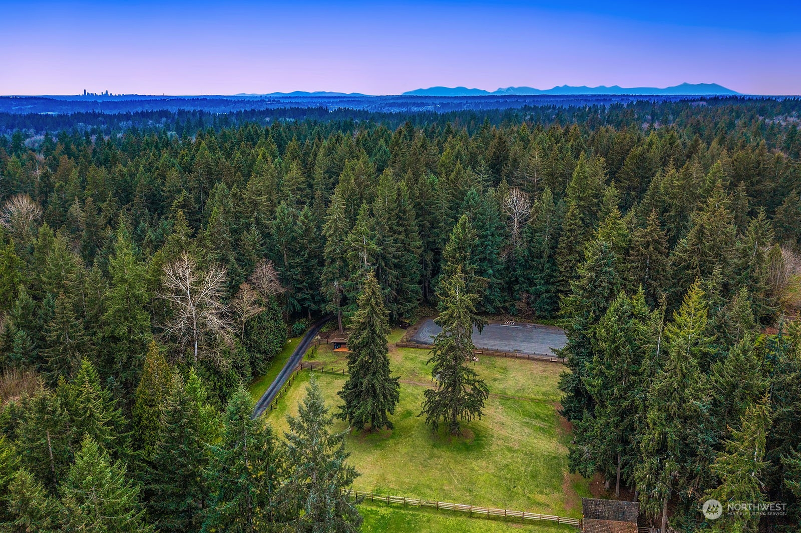 14050 184th Avenue Northeast Woodinville, WA 98072 - Photo 25 of 38 a view of a lake with a mountain in the background