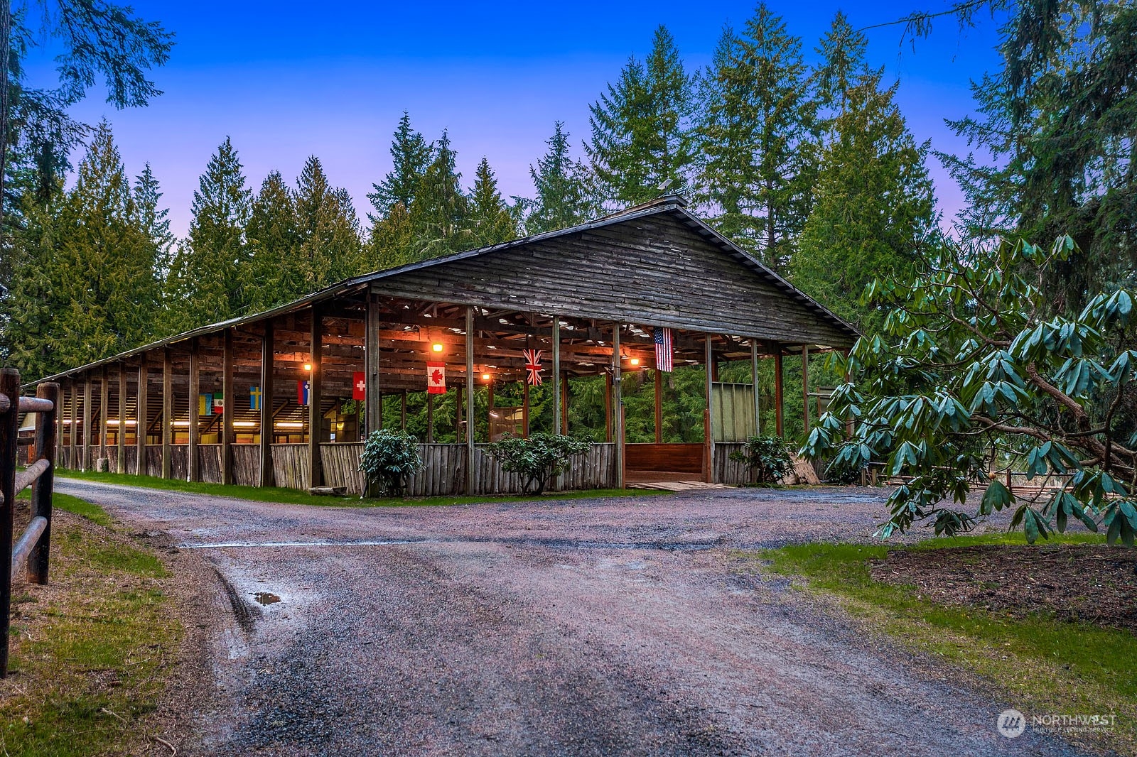 14050 184th Avenue Northeast Woodinville, WA 98072 - Photo 27 of 38 a view of a patio with a table and chairs under an umbrella