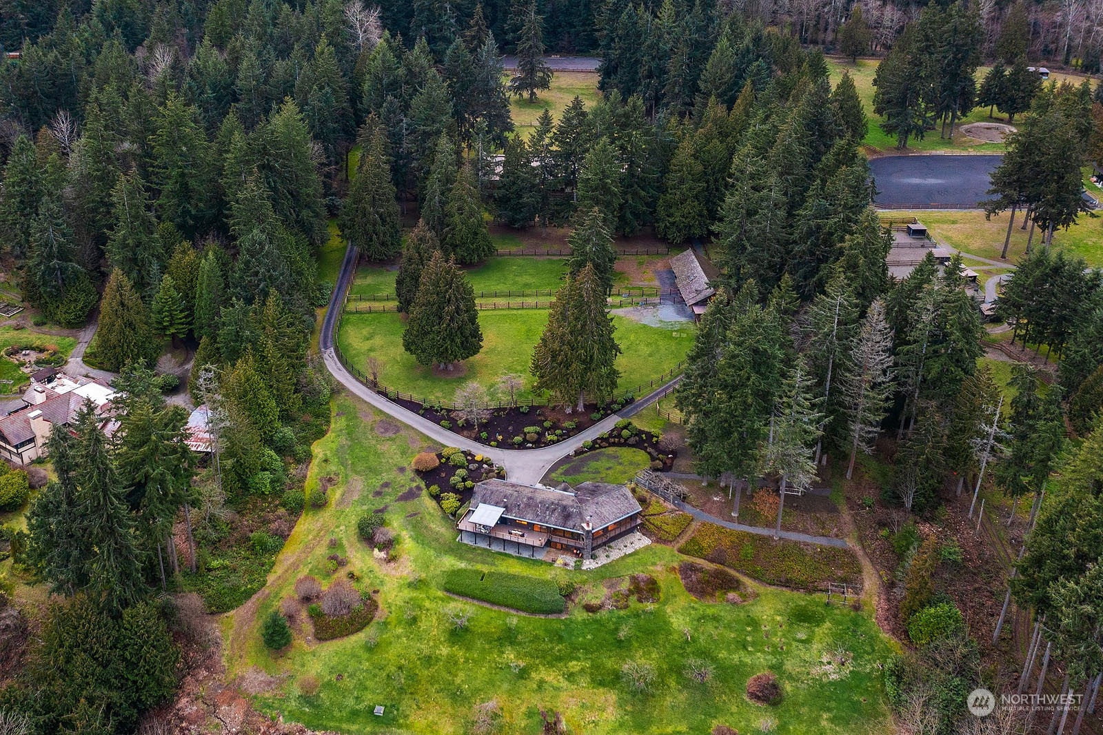 14050 184th Avenue Northeast Woodinville, WA 98072 - Photo 3 of 38 an aerial view of a house with a yard and lake view