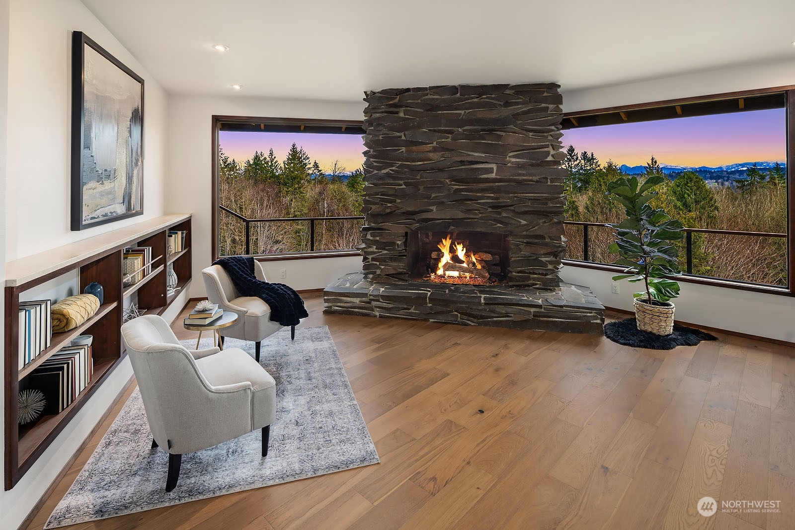14050 184th Avenue Northeast Woodinville, WA 98072 - Photo 5 of 38 a living room with furniture gym equipment and a fireplace