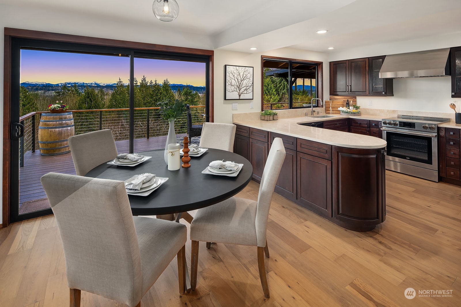 14050 184th Avenue Northeast Woodinville, WA 98072 - Photo 7 of 38 a view of a dining room with furniture window and wooden floor