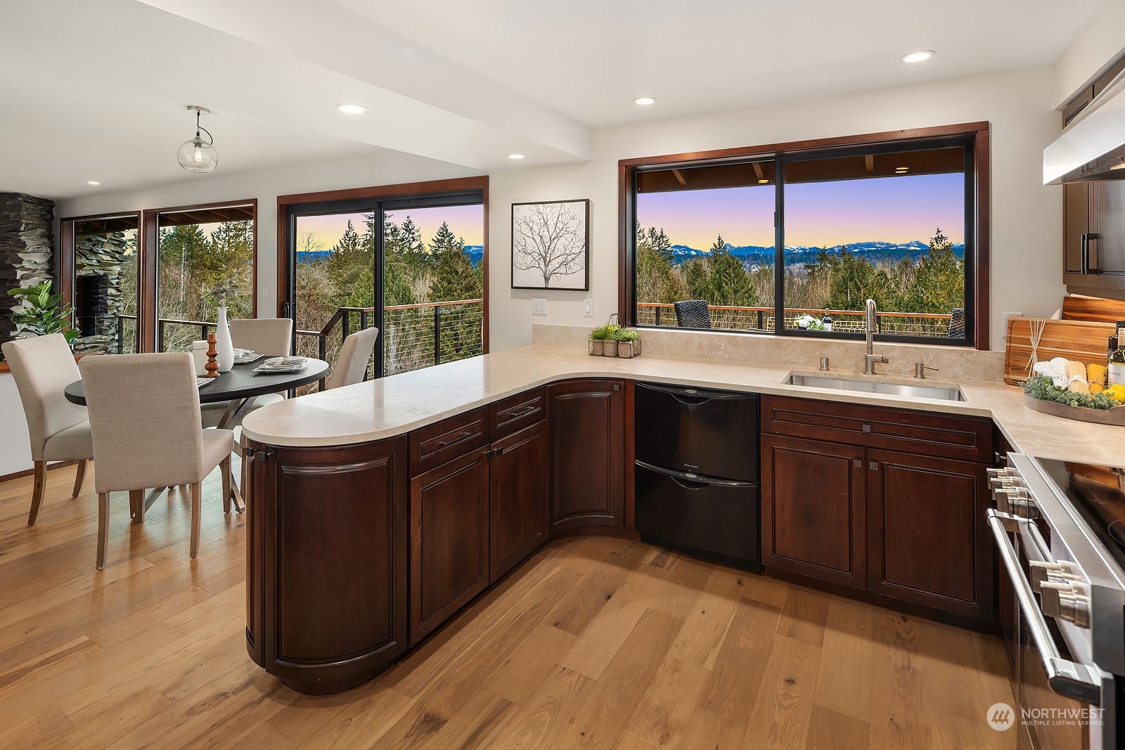 14050 184th Avenue Northeast Woodinville, WA 98072 - Photo 8 of 38 a kitchen with a sink stove and cabinets