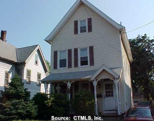 a view of house with yard and green space
