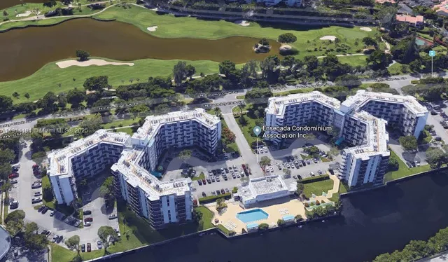 a aerial view of a house with a garden and swimming pool