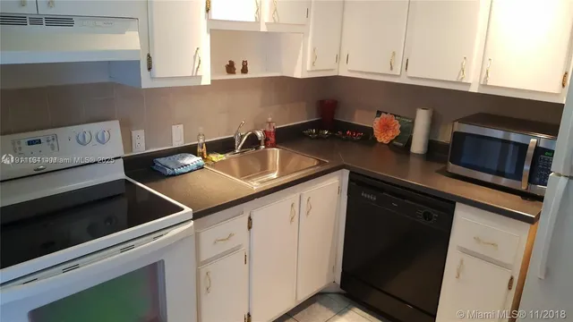 a view of a livingroom with a staircase