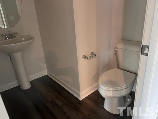 2403 Chert Lane, Unit 2403 Raleigh, NC 27610 - Photo 13 of 19 a bathroom with a sink and a toilet