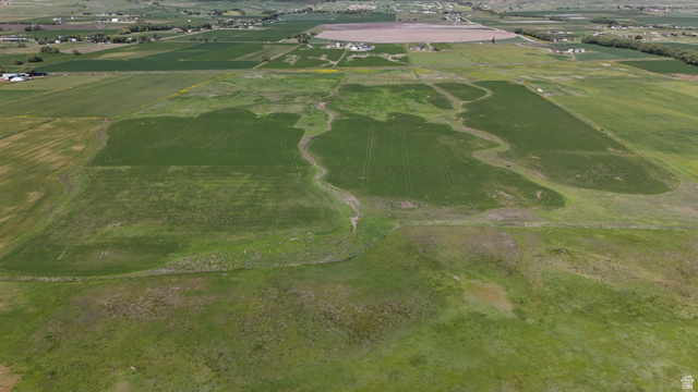 320 South 5400 West Logan, UT 84321 - Photo 2 of 42 Expansive agricultural land featuring cultivated fields and open green spaces