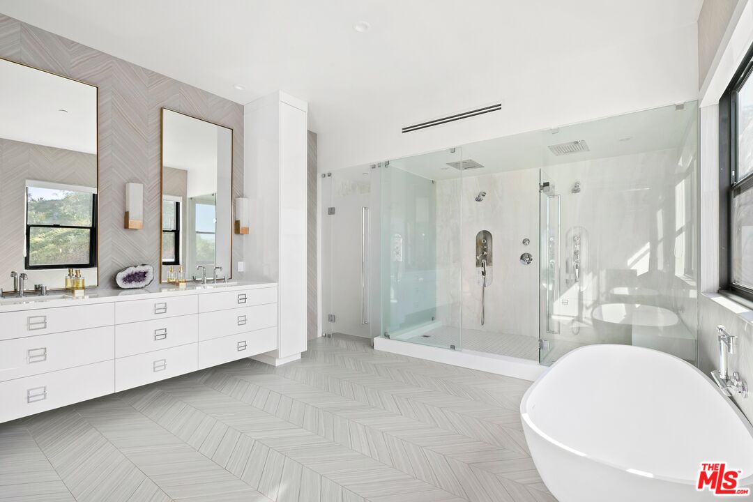 167 Saddlebow Road Bell Canyon, CA 91307 - Photo 11 of 33 a bathroom with a double vanity sink toilet mirror and bathtub