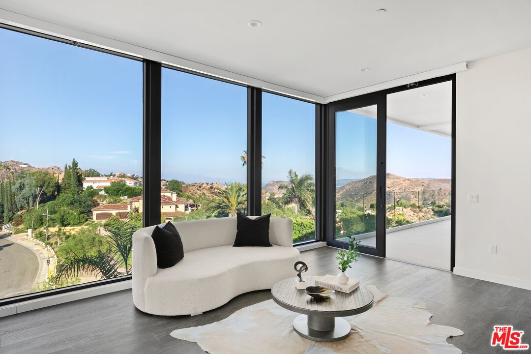 167 Saddlebow Road Bell Canyon, CA 91307 - Photo 12 of 33 a living room with furniture and a large window