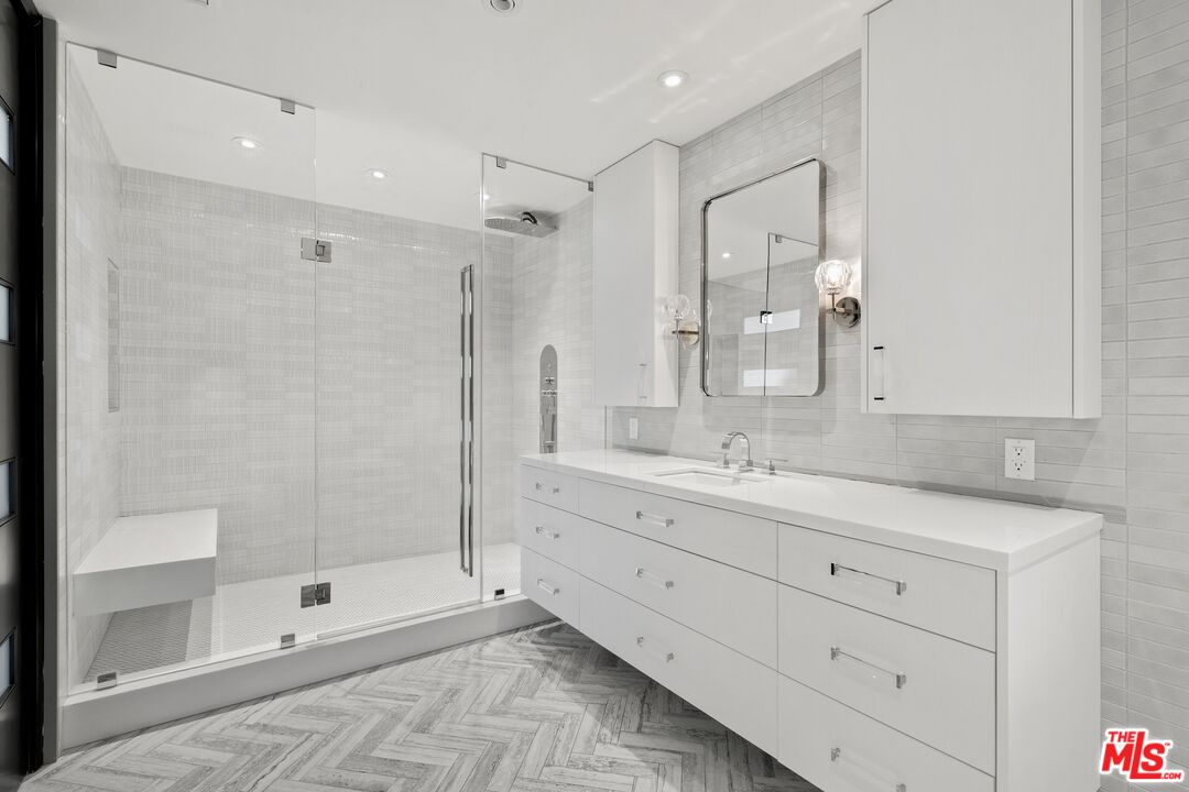 167 Saddlebow Road Bell Canyon, CA 91307 - Photo 17 of 33 a bathroom with a shower sink and mirror