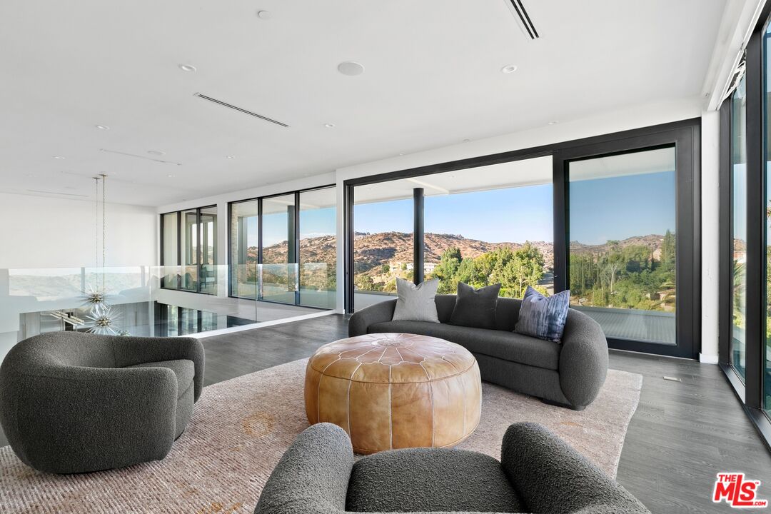 167 Saddlebow Road Bell Canyon, CA 91307 - Photo 19 of 33 a living room with furniture and a large window