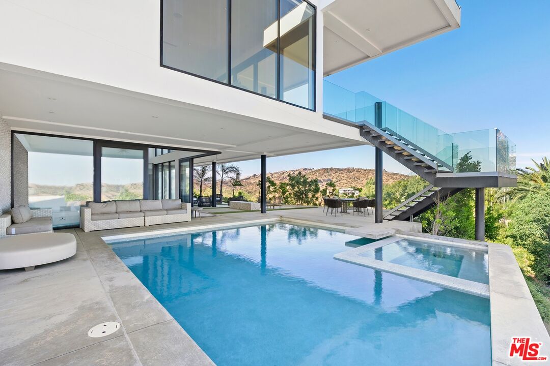 167 Saddlebow Road Bell Canyon, CA 91307 - Photo 22 of 33 a view of a swimming pool with seating space