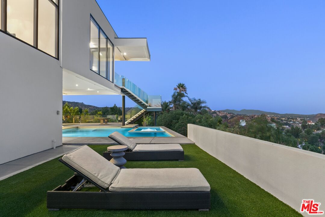 167 Saddlebow Road Bell Canyon, CA 91307 - Photo 24 of 33 a view of a patio with couches table and chairs and potted plants