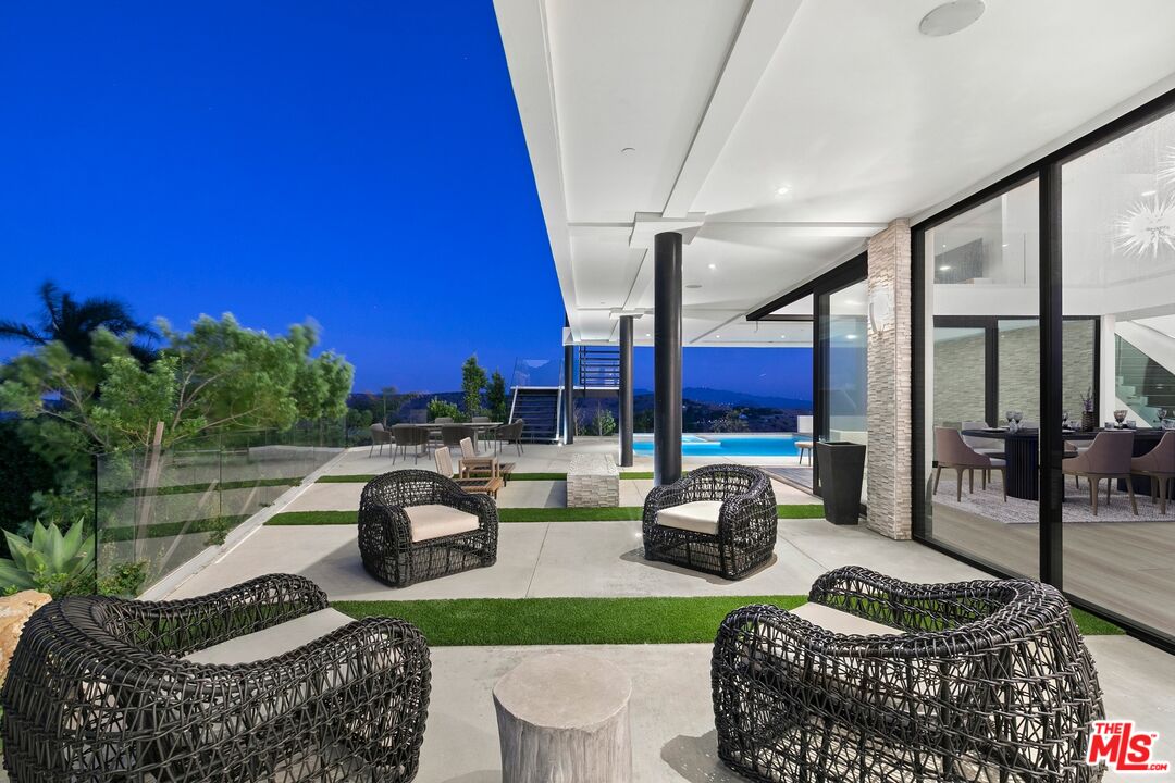 167 Saddlebow Road Bell Canyon, CA 91307 - Photo 25 of 33 a living room with furniture and a floor to ceiling window