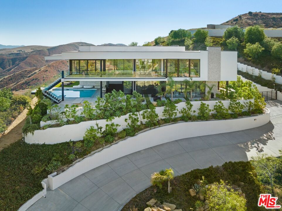 167 Saddlebow Road Bell Canyon, CA 91307 - Photo 29 of 33 a front view of a house with a yard