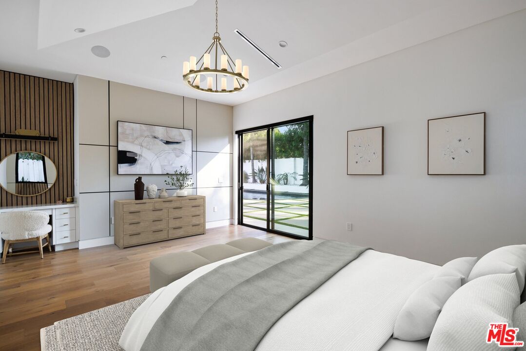 167 Saddlebow Road Bell Canyon, CA 91307 - Photo 31 of 33 a bedroom with a large bed and a chandelier