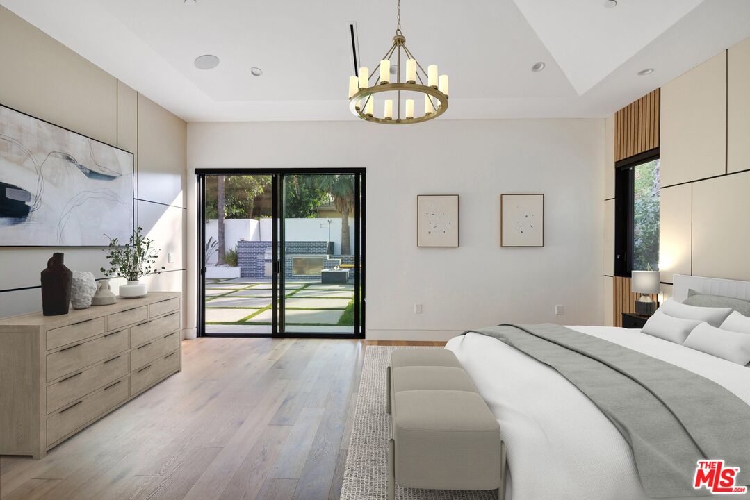 167 Saddlebow Road Bell Canyon, CA 91307 - Photo 32 of 33 a bedroom with a bed and a chandelier