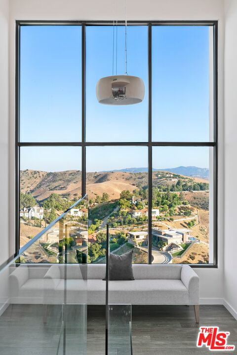 167 Saddlebow Road Bell Canyon, CA 91307 - Photo 8 of 33 a living room with glass top table and windows