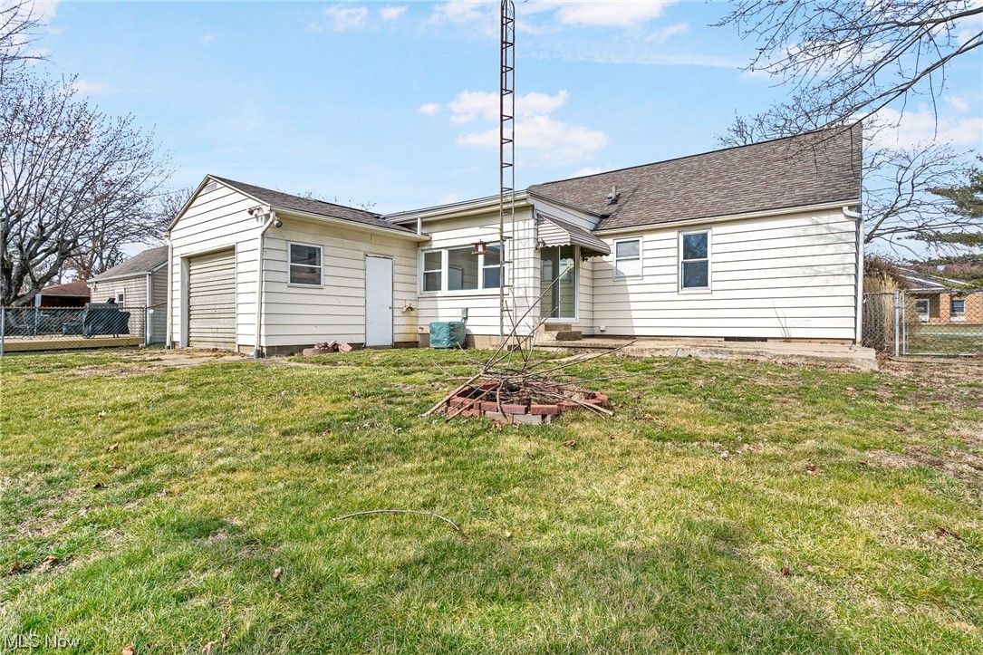 2942 17th Street Northwest Canton, OH 44708 - Photo 23 of 25 Rear view of property featuring a yard