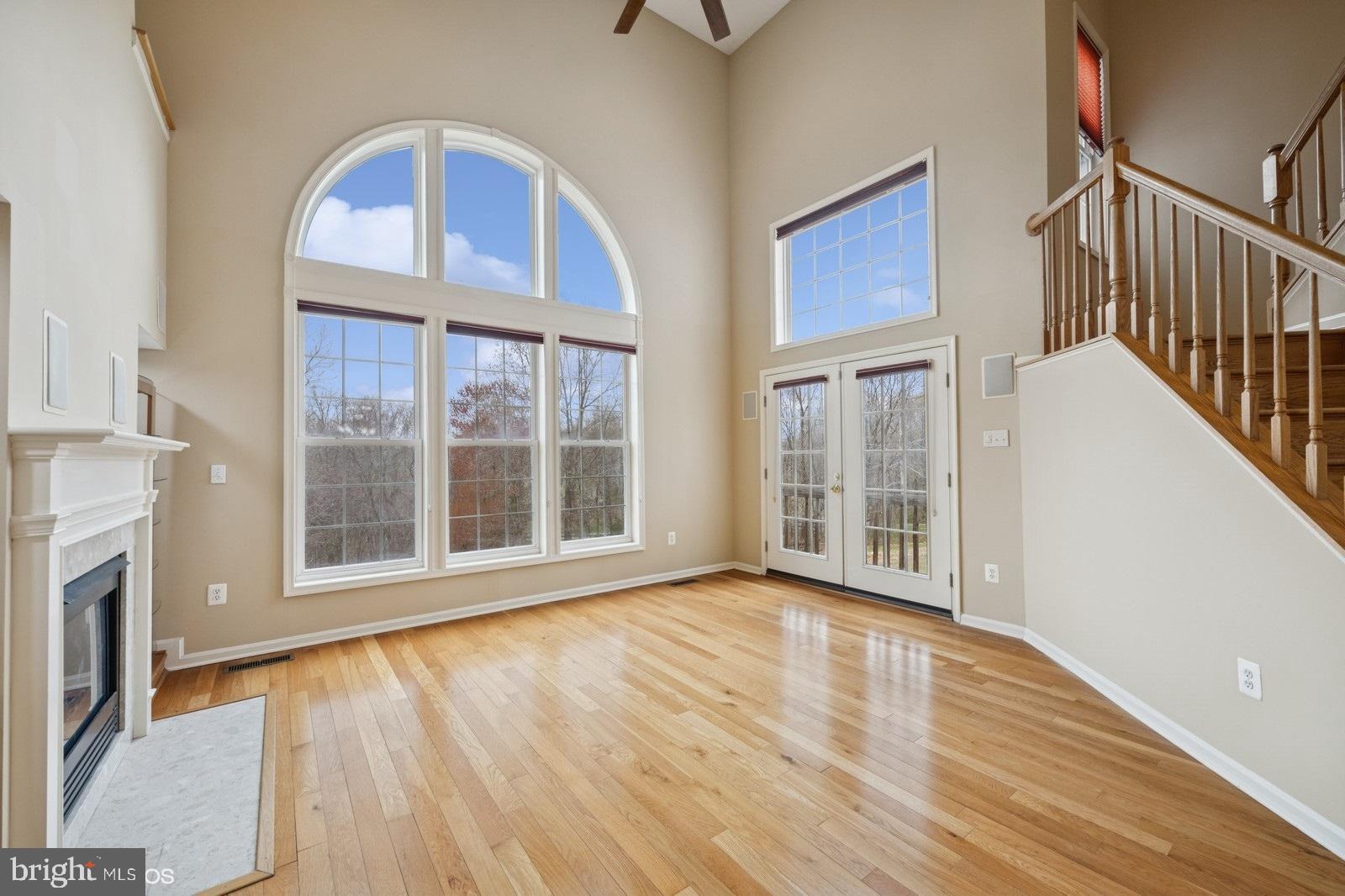 6965 Hawkins Gate Road La Plata, MD 20646 - Photo 12 of 55 a view of an empty room with wooden floor and a window