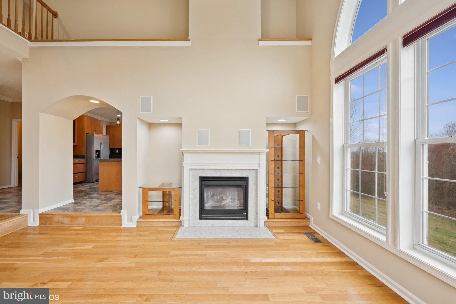 6965 Hawkins Gate Road La Plata, MD 20646 - Photo 14 of 55 a view of an empty room with fireplace and a window