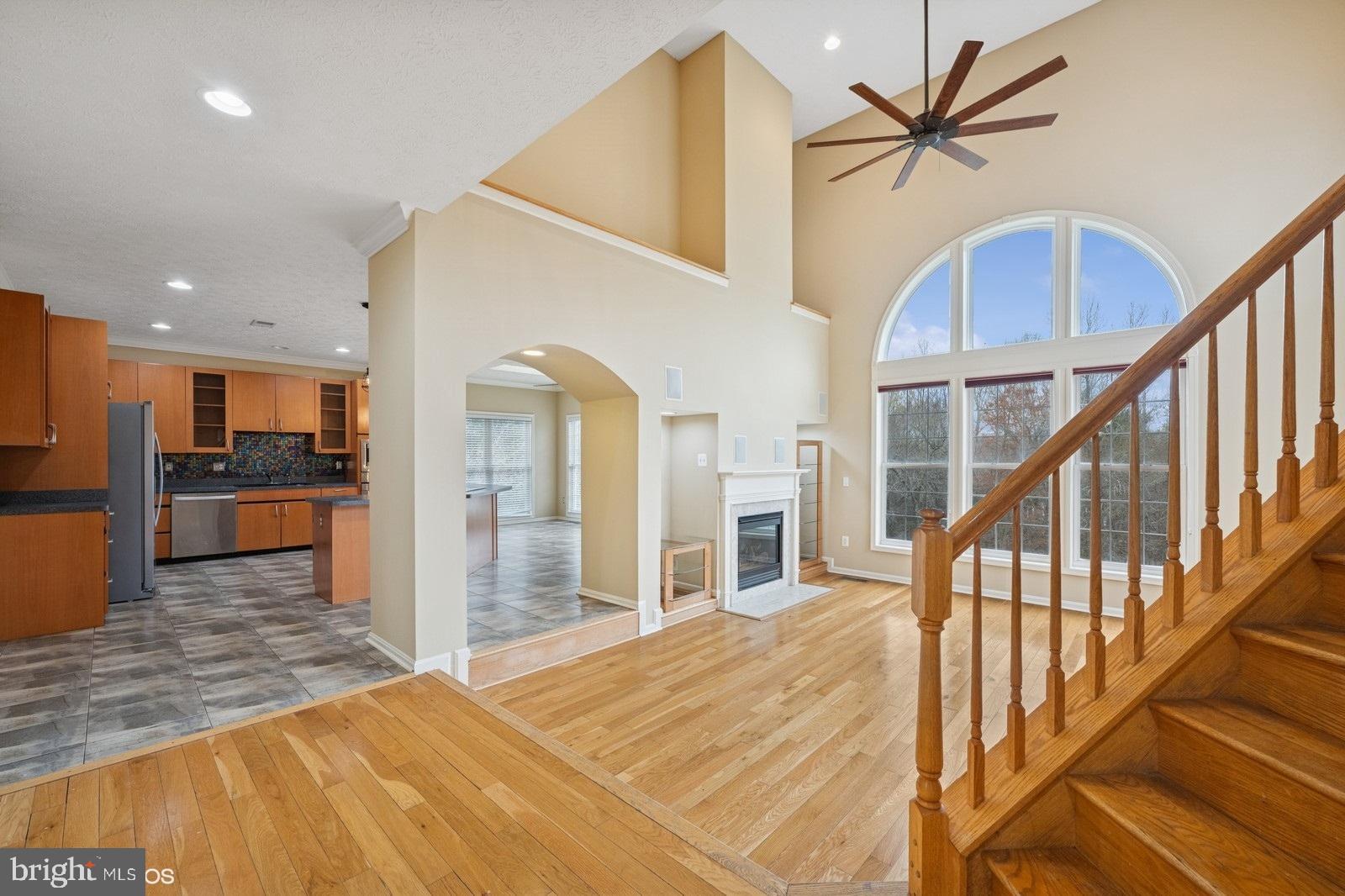 6965 Hawkins Gate Road La Plata, MD 20646 - Photo 16 of 55 a view of a hallway with wooden floor and staircase