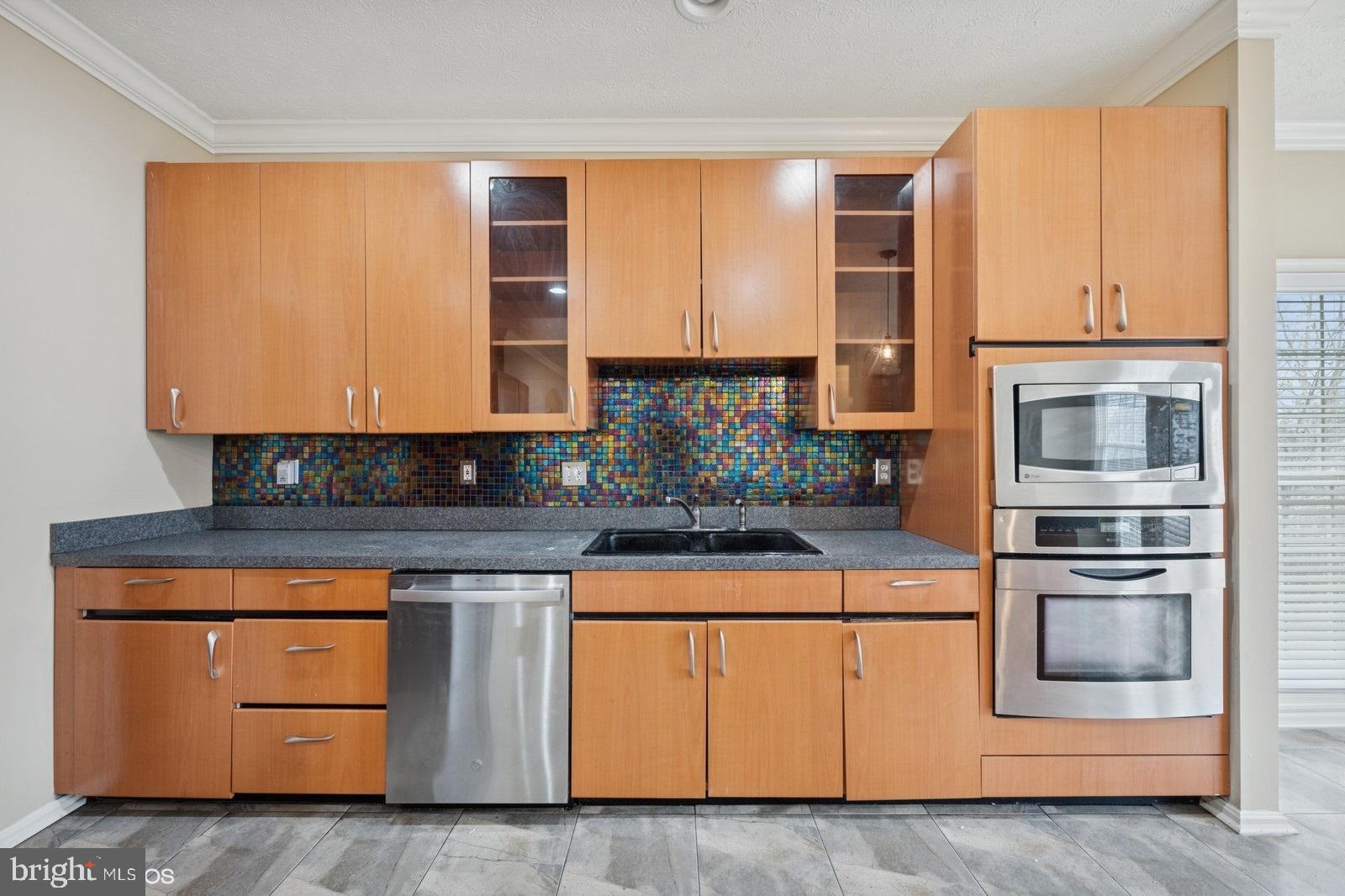 6965 Hawkins Gate Road La Plata, MD 20646 - Photo 19 of 55 a kitchen with stainless steel appliances granite countertop a stove and a microwave