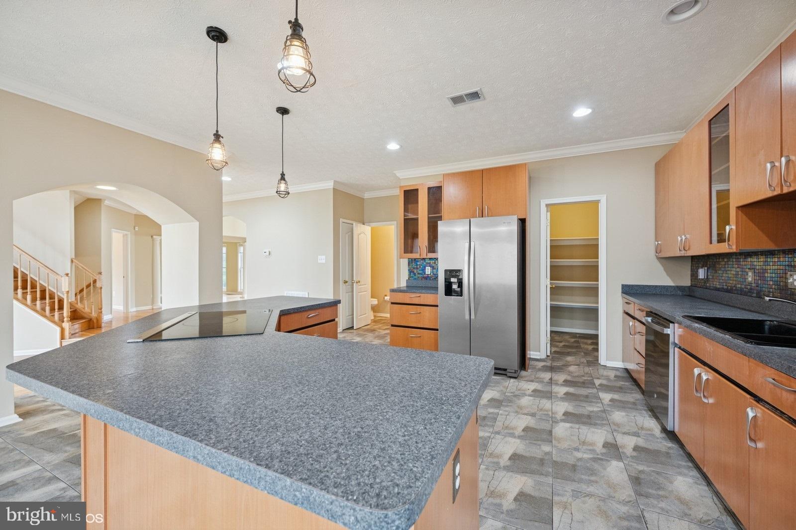 6965 Hawkins Gate Road La Plata, MD 20646 - Photo 20 of 55 a kitchen with stainless steel appliances granite countertop a sink a stove and a refrigerator