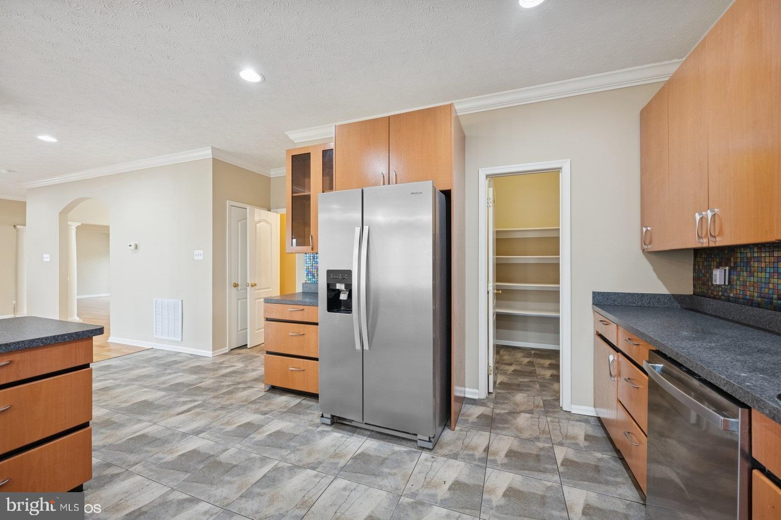 6965 Hawkins Gate Road La Plata, MD 20646 - Photo 21 of 55 a kitchen with stainless steel appliances granite countertop a refrigerator and a stove