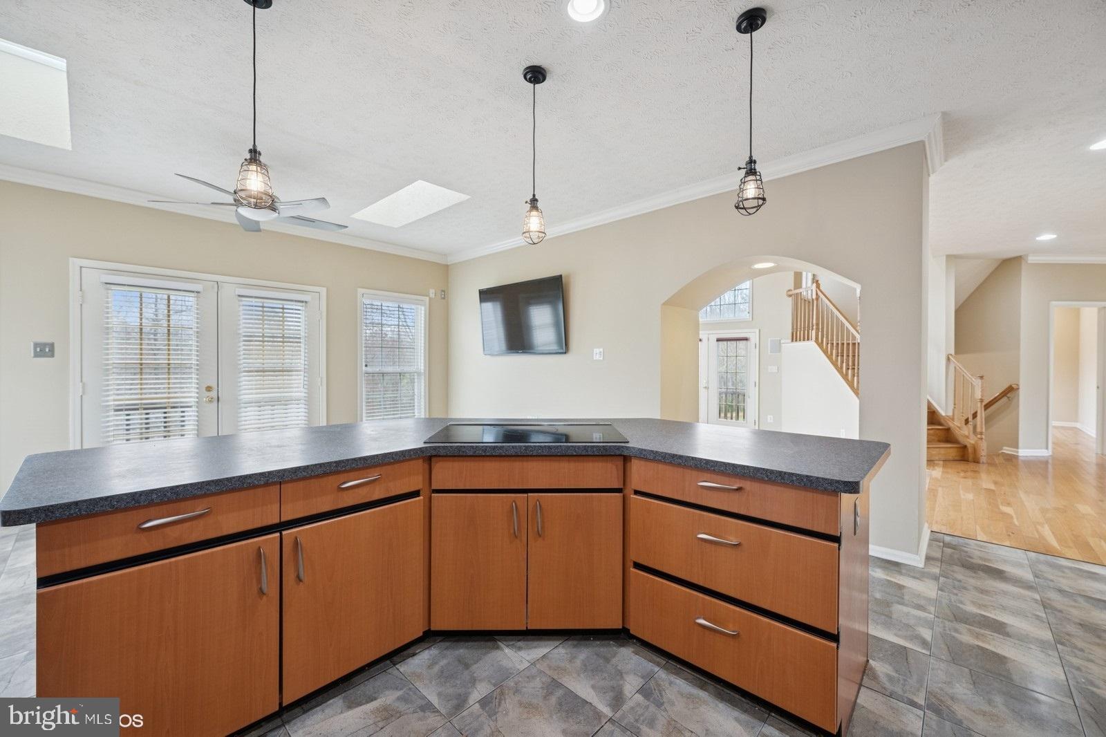 6965 Hawkins Gate Road La Plata, MD 20646 - Photo 22 of 55 a kitchen with a sink and dishwasher with wooden floor