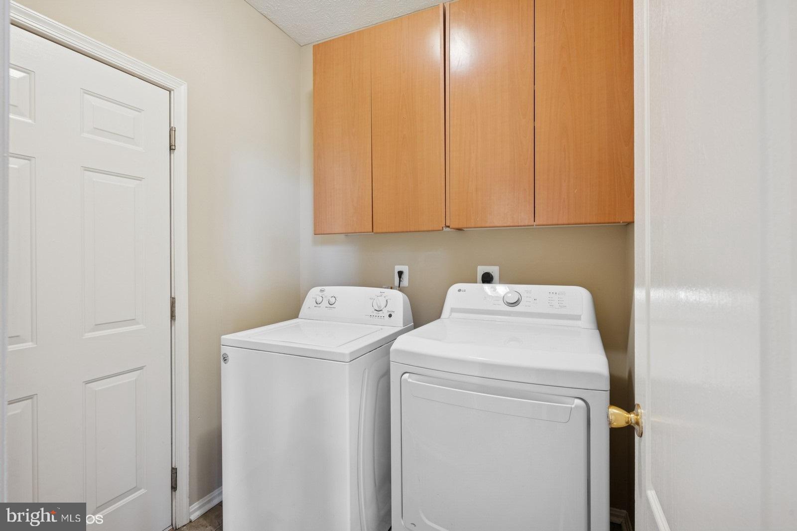 6965 Hawkins Gate Road La Plata, MD 20646 - Photo 24 of 55 a utility room with dryer and washer