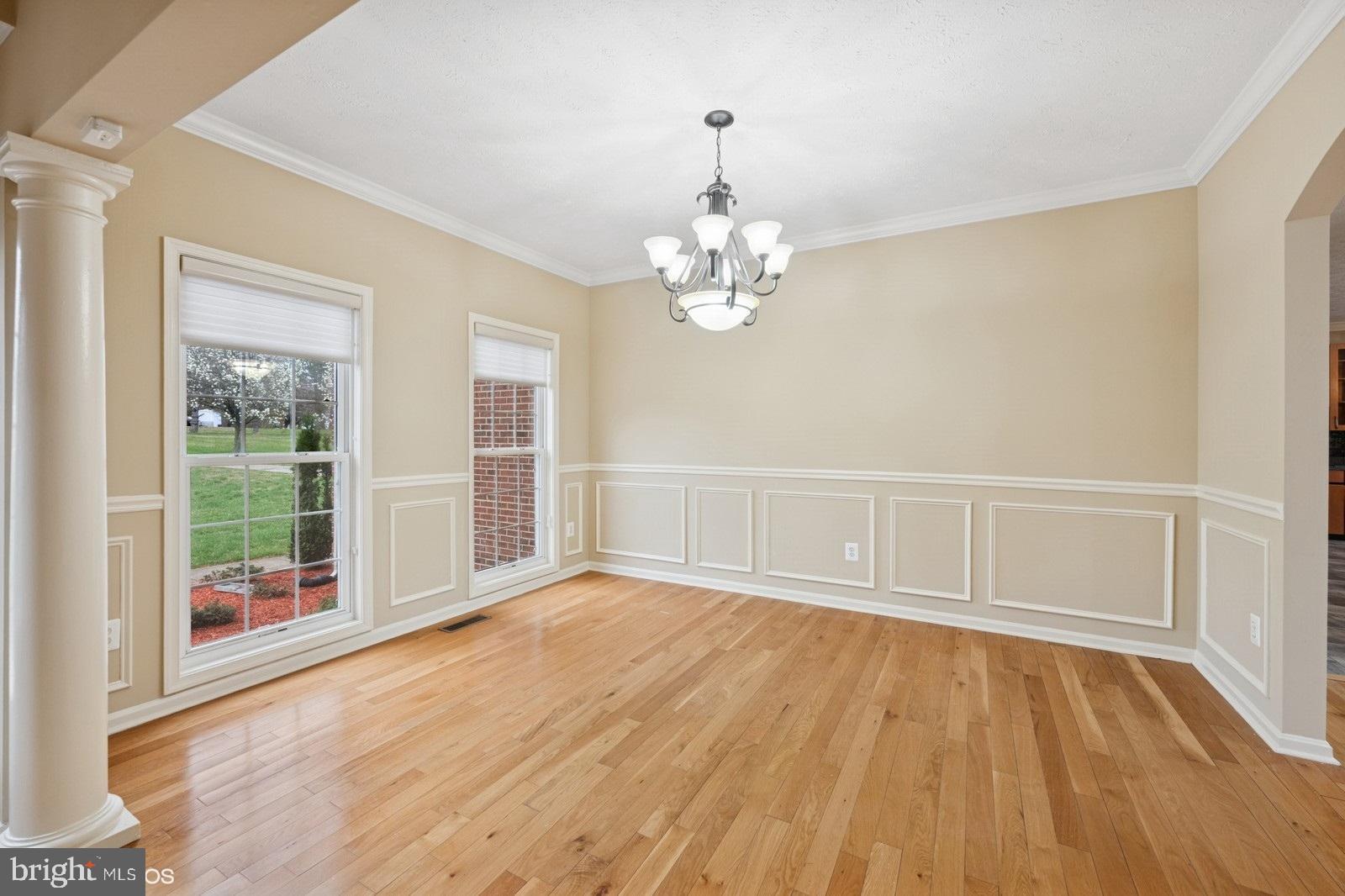6965 Hawkins Gate Road La Plata, MD 20646 - Photo 7 of 55 a view of an empty room with wooden floor and a window